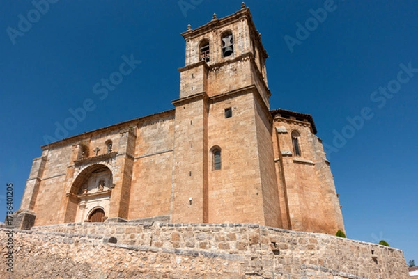 Fototapeta The historic Gothic Church of the Assumption, with a 17th-century Renaissance portal, in Olmedillo de Roa, Spain.a
