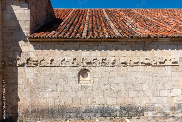 Fototapeta The 12th-13th century Romanesque frieze known as the "mensario" (agricultural calendar) on the Chapel of San Galindo in Campisábalos, Spain.