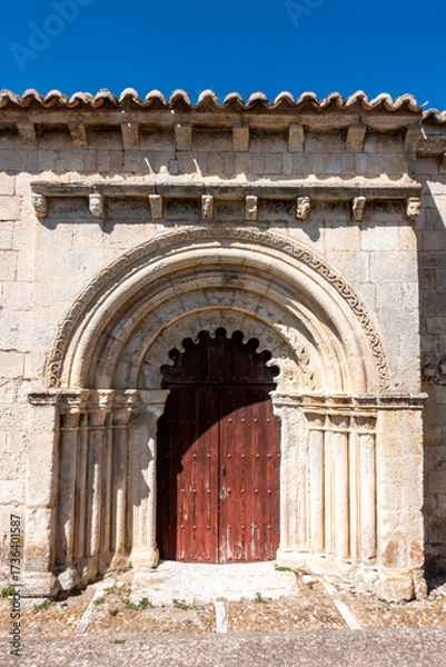 Fototapeta The ornate 12th-13th century Romanesque portal of the Chapel of San Galindo in Campisábalos, Spain.