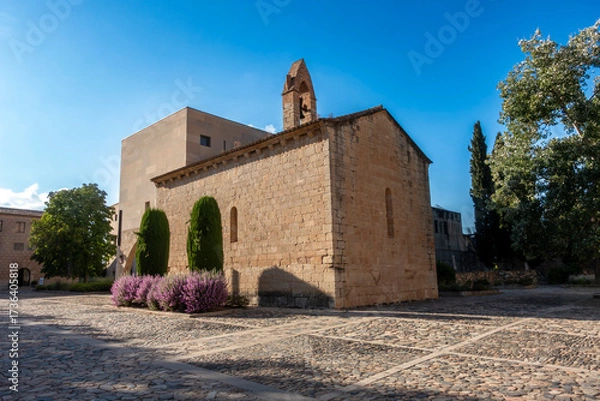 Fototapeta The 12th-century Romanesque Chapel of Saint Catherine in the main courtyard of the Royal Monastery of Poblet, a UNESCO World Heritage Site