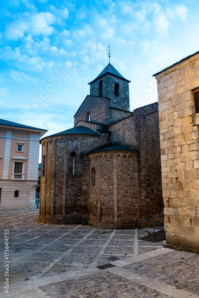 Fototapeta The ancient Romanesque apse of the Church of Sant Miquel in the cathedral complex of La Seu d'Urgell, pictured at twilight in the Catalan Pyrenees