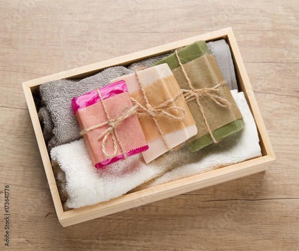 Obraz Handmade soap and towels in wooden box