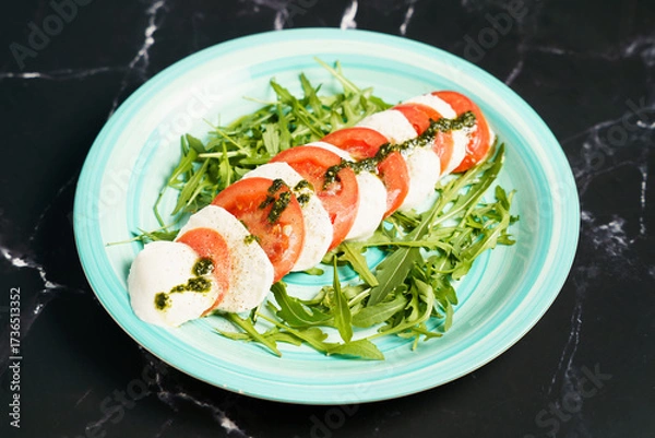 Obraz Caprese salad with mozzarella and arugula