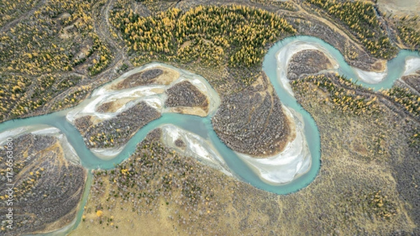 Fototapeta autumn landscape from above, with a winding turquoise mountain river