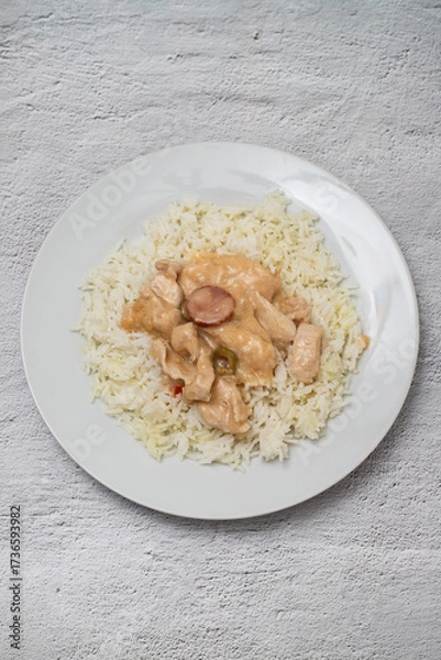 Fototapeta chicken stroganoff with boiled rice on plate