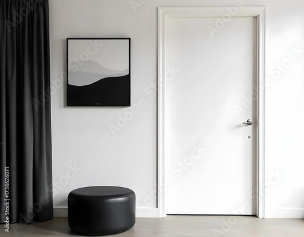 Fototapeta White door with white handle, a black and white painting on the wall, a black curtain and a black pouf in a gray room.