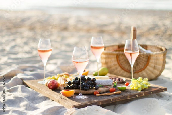 Obraz Refreshing  Rosa Wine in a Glass . Beach Cheers Celebration Friendship Summer Fun Dinner Concept.