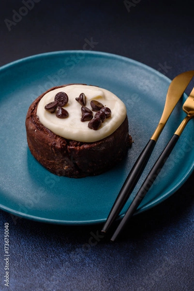 Fototapeta Cinnamon roll, a sweet bun with citrus, cherries, and chocolate, a Danish dessert with cream