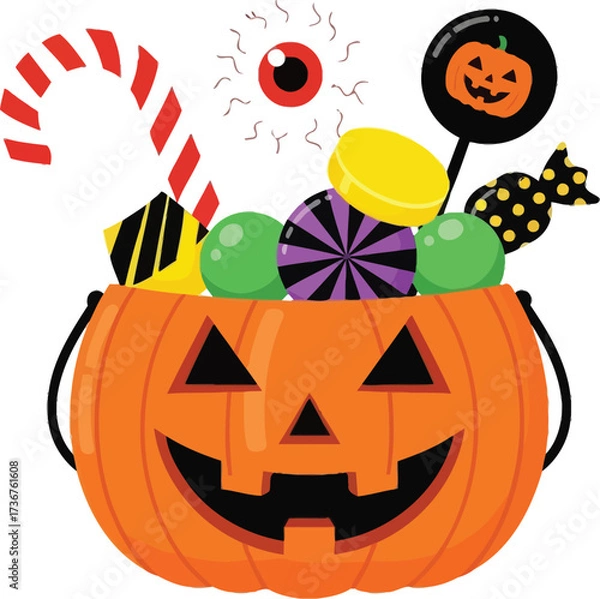 Fototapeta Spooky halloween pumpkin bucket overflowing with colorful candies and treats for trick or treat