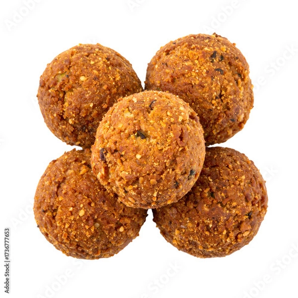 Obraz Five golden-brown, round food items are arranged against a stark black background.  These textured items appear crisp, perhaps fried, with visible specks of herbs and spices.