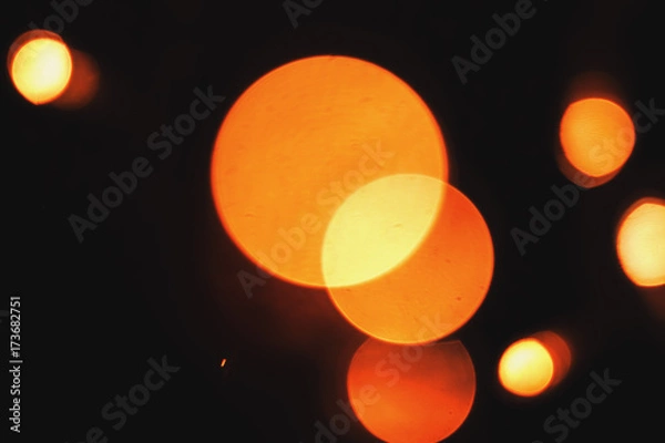 Fototapeta Abstract Close-Up Of Three Conjoined Defocused Orange Christmas Lights Taken With Helios 44-2 Vintage Lens During Night