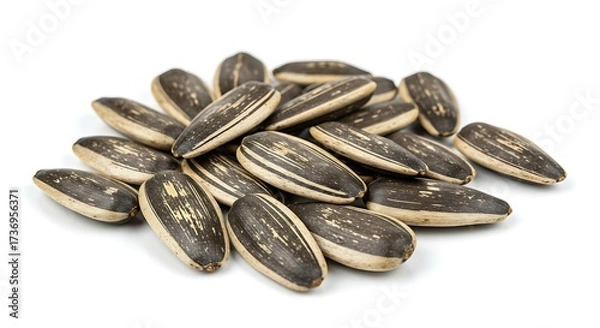 Fototapeta Pile of striped sunflower seeds on bright white background, macro shot
