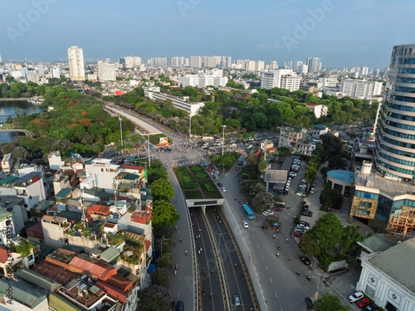 Fototapeta Aerial cityscape of Hanoi with Kim Lien street, buildings, and green spaces.