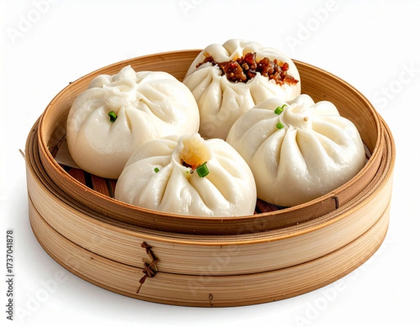 Obraz Four fluffy Chinese steamed buns (bao/bakpao) with various fillings, presented beautifully in a traditional bamboo steamer basket on white.