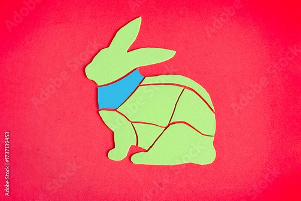 Fototapeta An image of a rabbit carcass with a brightly highlighted neck. The meat fillet of rabbit is schematically shown.