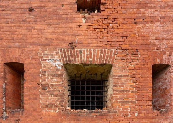 Fototapeta An old red-brick building, a European-style fortress