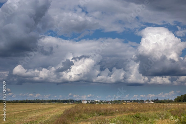 Fototapeta A fabulously beautiful and unusually bright sky with white clouds