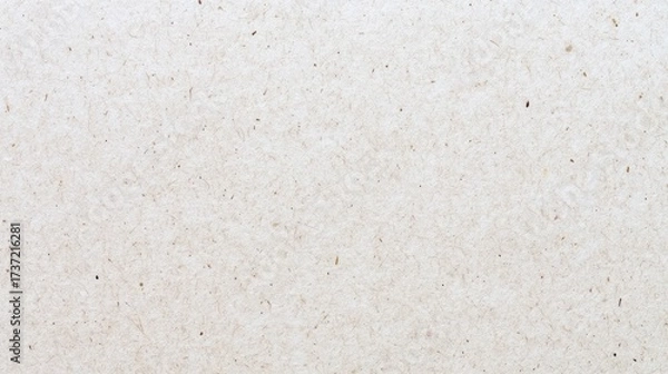 Fototapeta Close-up of a textured, light beige paper surface with subtle speckles