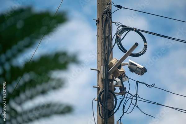 Fototapeta Security Camera on Electric Pole in Daylight