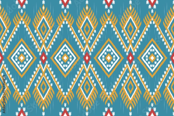 Fototapeta Ikat tribal ethnics in multi-colors combination and beautiful design - Seamless pattern ikat