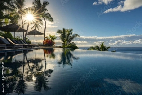 Fototapeta Luxury escape beckons with infinity pool overlooking the ocean at a stunning resort, promising relaxation and tropical vibes with sunlit palm trees