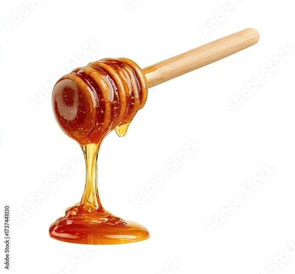 Fototapeta Golden honey dripping from a wooden honey dipper against a stark white background (1)