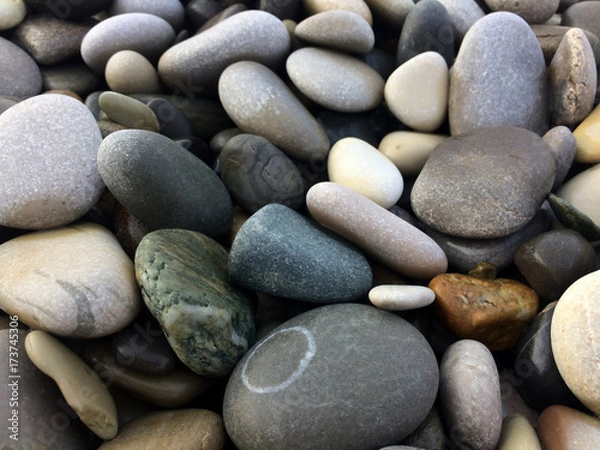 Fototapeta background, beach, wallpaper, stone, pebble, texture, natural, colorful, abstract, sea, pattern, nature, smooth, photo, color, closeup, surface, shape, pebbles, rock, material, gravel, black, decorati