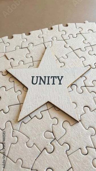Fototapeta Star with Unity Word on Puzzle Background Symbolizing Togetherness