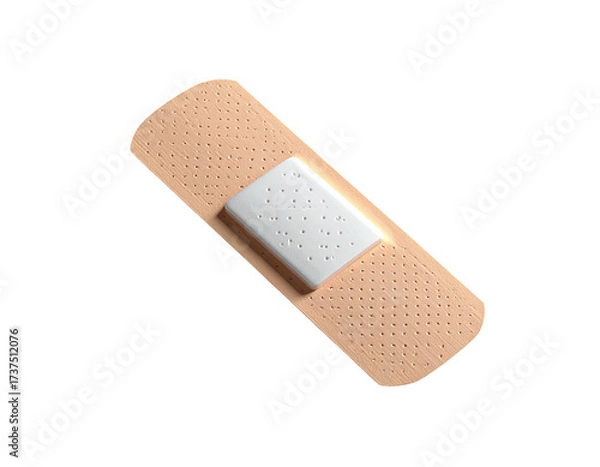 Fototapeta A tan adhesive bandage with a white pad, isolated against a black background