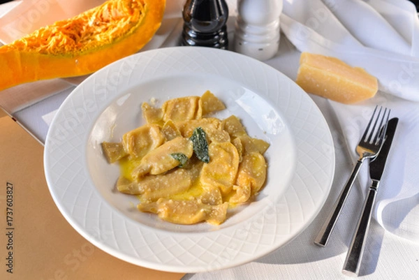 Fototapeta Ravioli with pumpkin in a plate on the table