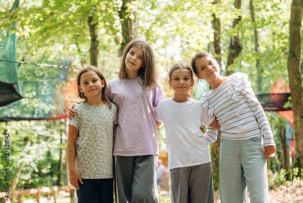 Obraz Group of kids are having fun together in the park
