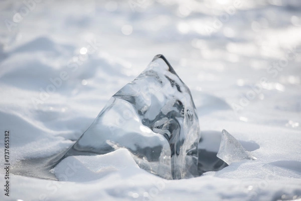 Fototapeta Smooth ice formation emerging from snow.