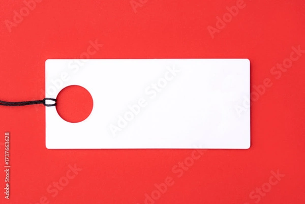 Fototapeta Empty white tag on red background.