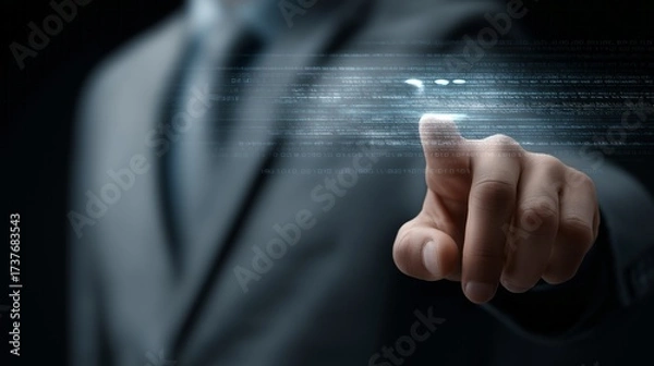 Fototapeta A man in a suit is pointing at a screen with a blue line