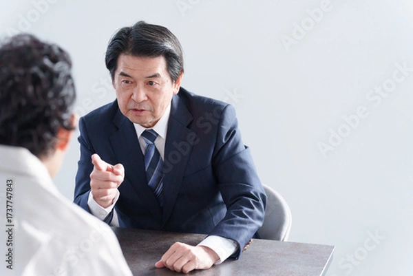 Obraz 怒るビジネスマンと男性