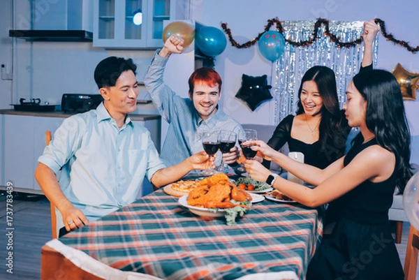 Fototapeta Diversity, dinner and group of people toast celebration together at party. Friends, happy and celebrate with food, wine and friendship for love, support and cheers champagne at business function