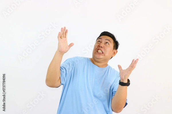 Fototapeta Man Looking Up in Surprise expression