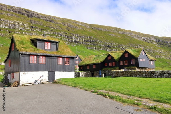 Obraz the village of Kirkjubour, famous for the ruins of an ancient cathedral, Kirkjubomururin, on the island of Streymoy, Europe, Faroe Islands, Denmark