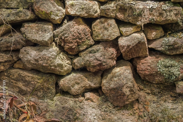 Fototapeta A section of a very old stone wall used as a fence in the past, in the eastern Andean mountains of central Colombia, near the village of Cucaita.