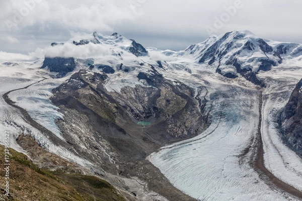 Fototapeta Panorama of cloud layer from mountain top over Swiss alps