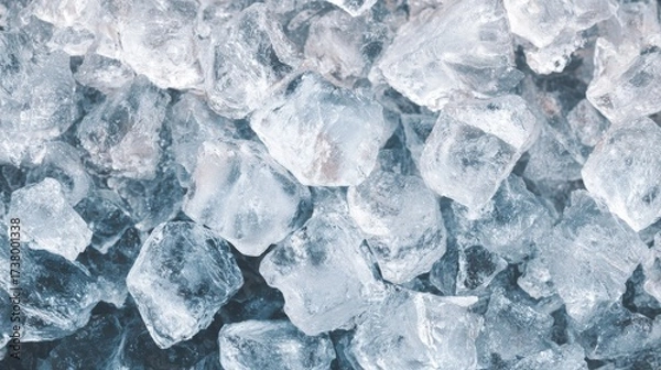 Fototapeta Top view of crushed ice pieces forming a cool refreshing background texture