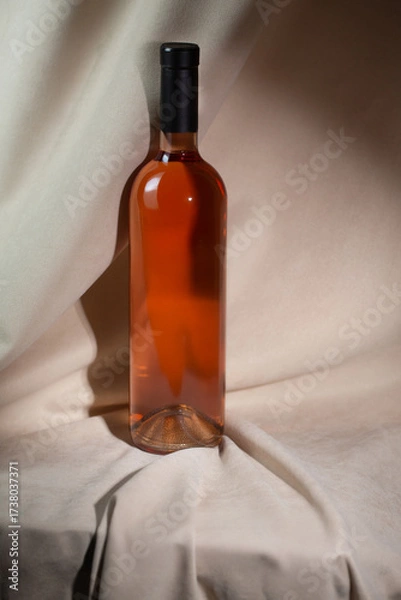 Fototapeta Wine bottle mockup showcasing elegant design with soft lighting and smooth textures, ideal for branding and marketing concepts with copy space