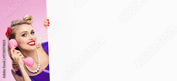 Fototapeta Image - happy pinup beautiful smile girl, with phone tube, white empty banner with free space, sale text sign area, isolated pink background. Cute pin up calling woman advertise. Ad concept