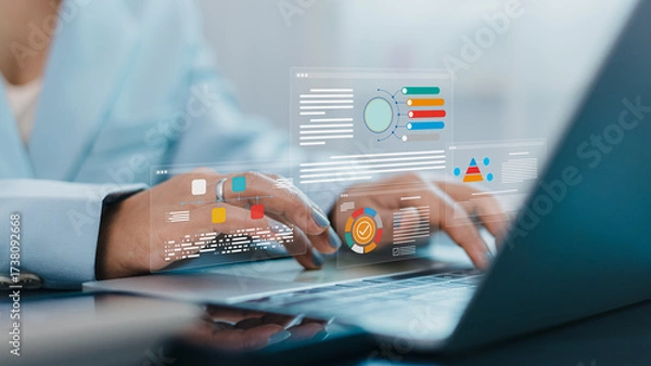 Fototapeta Businesswoman using laptop with data analytics dashboard and digital business report visualization