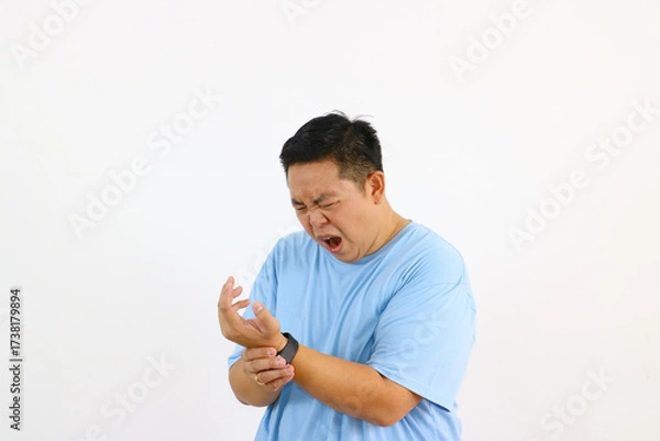 Fototapeta Man Experiencing very bad Wrist Pain A Closeup View