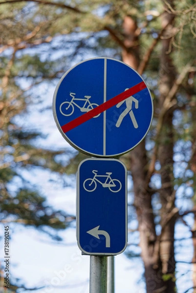Fototapeta European End of Shared Bicycle and Pedestrian Path Sign with Left Arrow Bicycle Sign