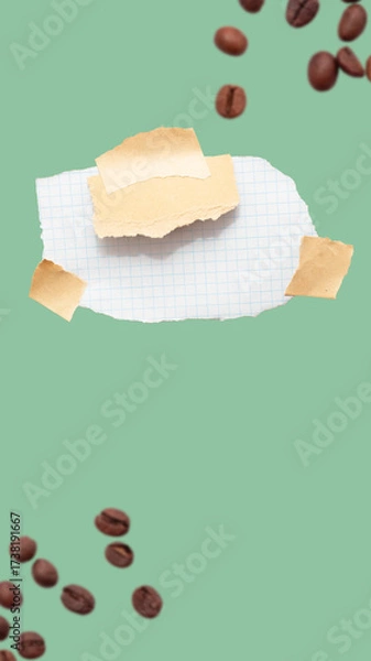 Fototapeta Torn piece of school notebook in a grid and brown piece of paper with beige tape on green background