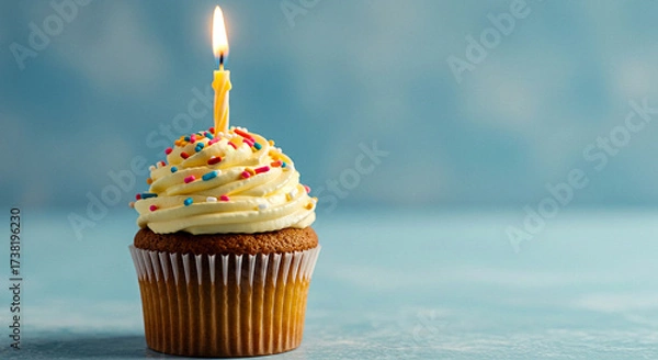 Obraz Birthday cupcake with lit candle isolated