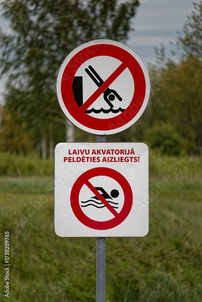 Fototapeta European Prohibition Signs No Diving and No Swimming with Latvian Text Laivu Akvatorijā Peldēties Aizliegts