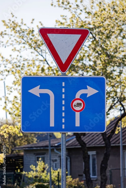 Fototapeta European Give Way Sign with Lane Directions Left and Right with Truck Restriction
